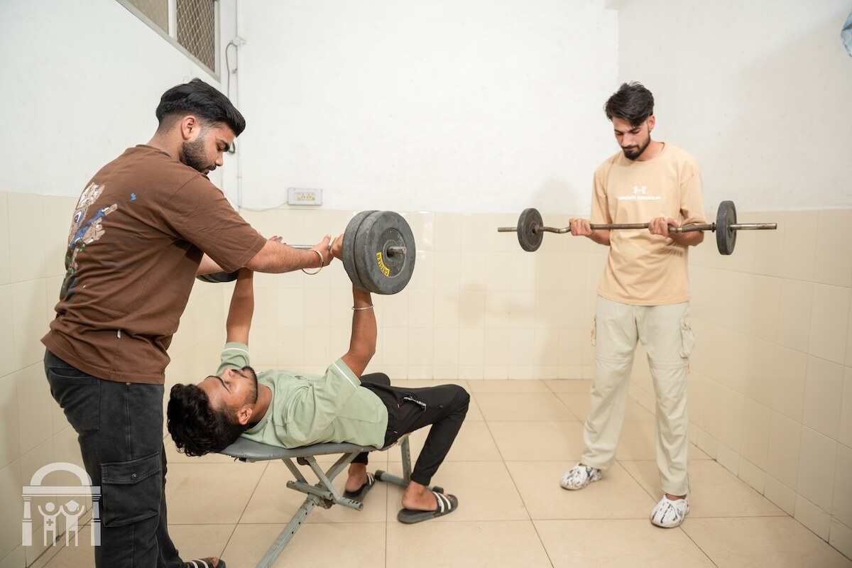 Students using weights in a student gym at Guru Nanak Paramedical College Dhahan Kaleran Punjab
