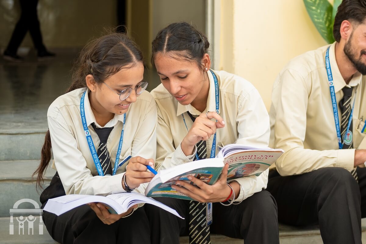 students reading on footsteps at Guru Nanak Paramedical College in Punjab